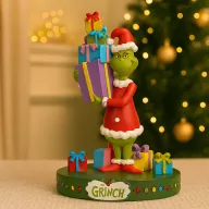   GRINCH® Karácsonyi szobor ajándékokkal díszdobozban 15 cm