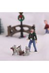 Téli falu kiegészítő kutyákat sétáltató férfi figura