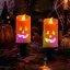 Halloweeni LED-es figurás gyertya gyertyatartóval, 12cm